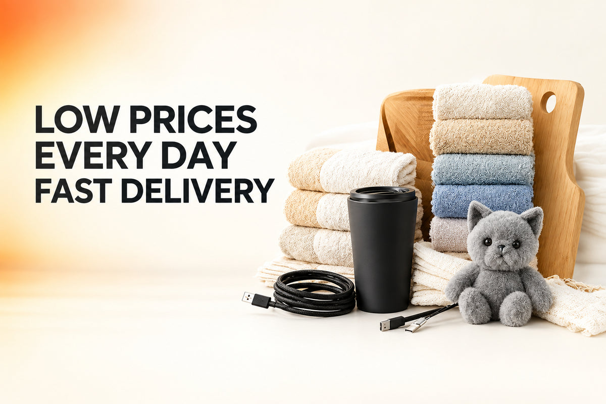 A promotional banner with the text 'LOW PRICES EVERY DAY FAST DELIVERY', alongside a styled arrangement of folded towels in cream, beige, and blue, a black travel tumbler, a black cable, a small gray plush cat, and a wooden cutting board on a light background.